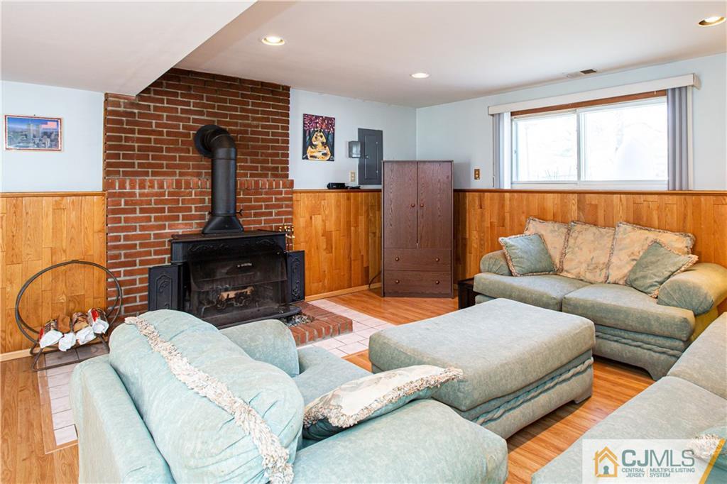 7 Fulton Road Somerset, NJ 08873 - Photo 20 of 24 a living room with furniture a fireplace and a window