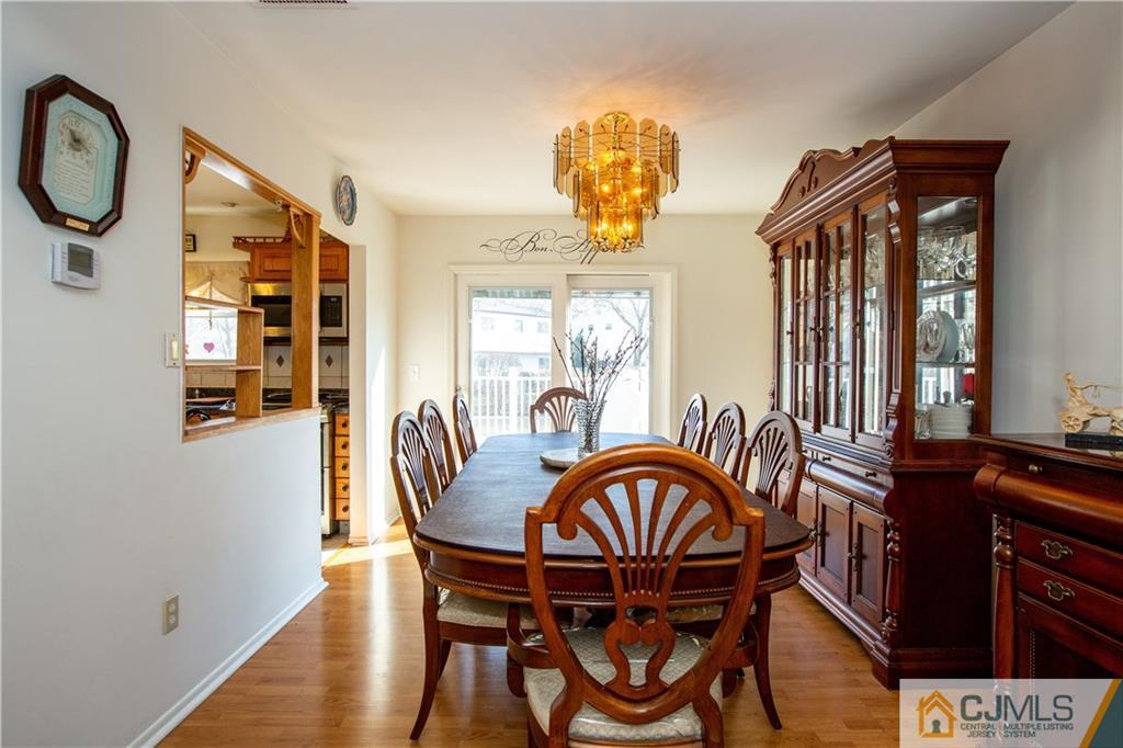 7 Fulton Road Somerset, NJ 08873 - Photo 4 of 24 a view of a dining room with furniture and chandelier
