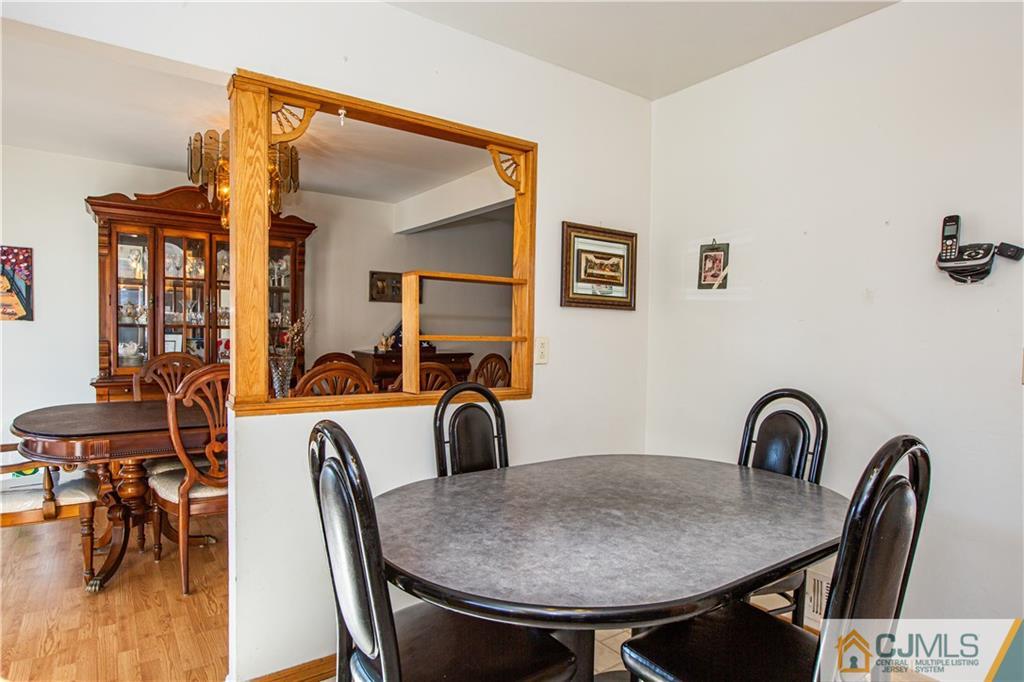 7 Fulton Road Somerset, NJ 08873 - Photo 7 of 24 a view of a dining room with furniture and wooden floor