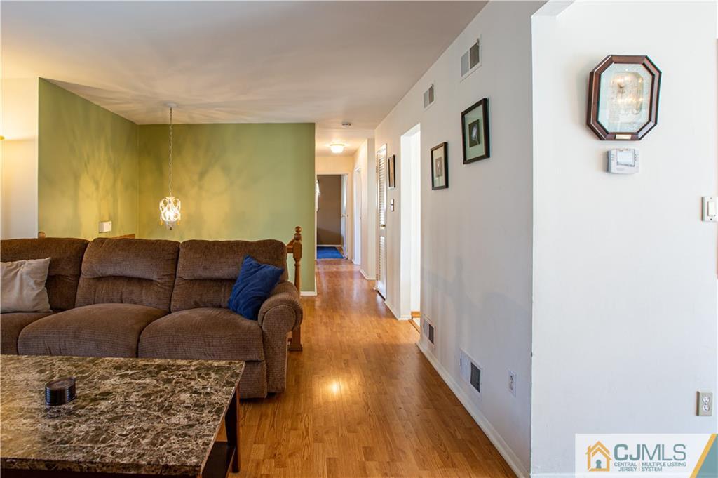 7 Fulton Road Somerset, NJ 08873 - Photo 8 of 24 a living room with furniture and a wooden floor
