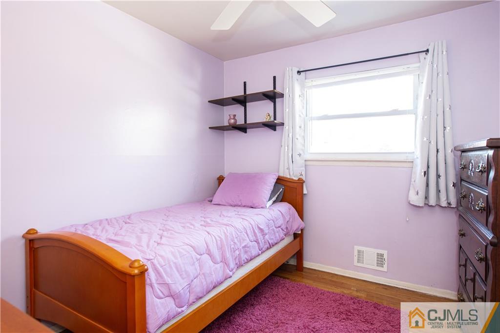 7 Fulton Road Somerset, NJ 08873 - Photo 10 of 24 a bedroom with a bed and window