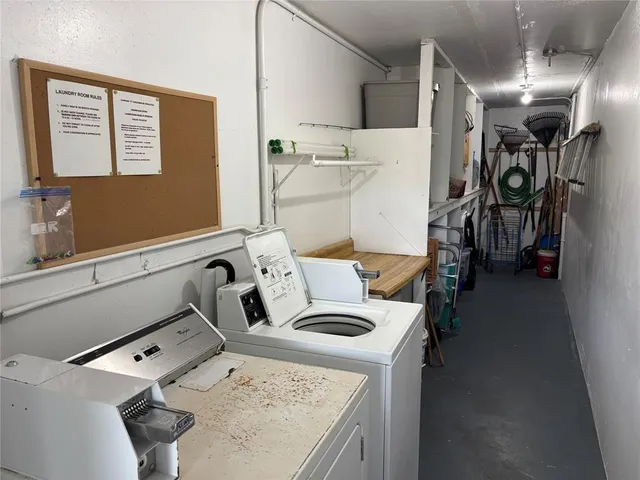 a view of a swimming pool and trees in the background
