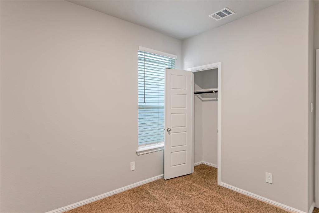 3116 Pecan Farm Lane Fort Worth, TX 76140 - Photo 15 of 25 an empty room with windows