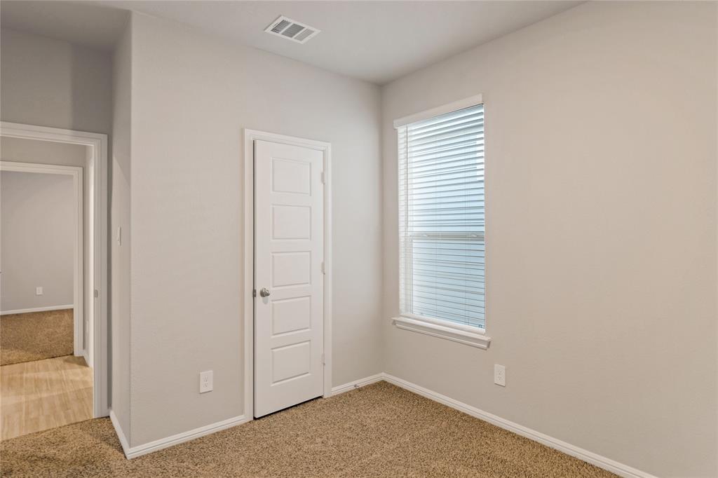 3116 Pecan Farm Lane Fort Worth, TX 76140 - Photo 19 of 25 an empty room with windows