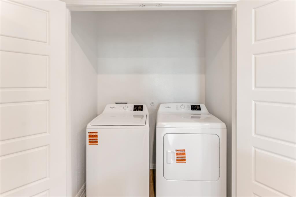 3116 Pecan Farm Lane Fort Worth, TX 76140 - Photo 20 of 25 a utility room with dryer and washer