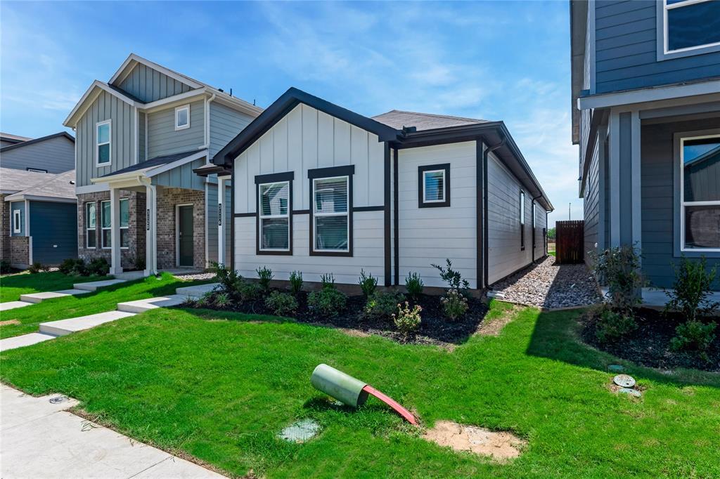 3116 Pecan Farm Lane Fort Worth, TX 76140 - Photo 8 of 25 a front view of a house with a garden and plants
