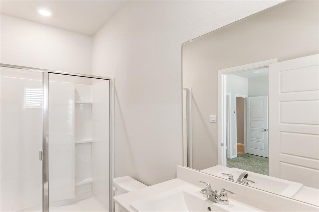 3116 Pecan Farm Lane Fort Worth, TX 76140 - Photo 9 of 25 a bathroom with a sink and a mirror