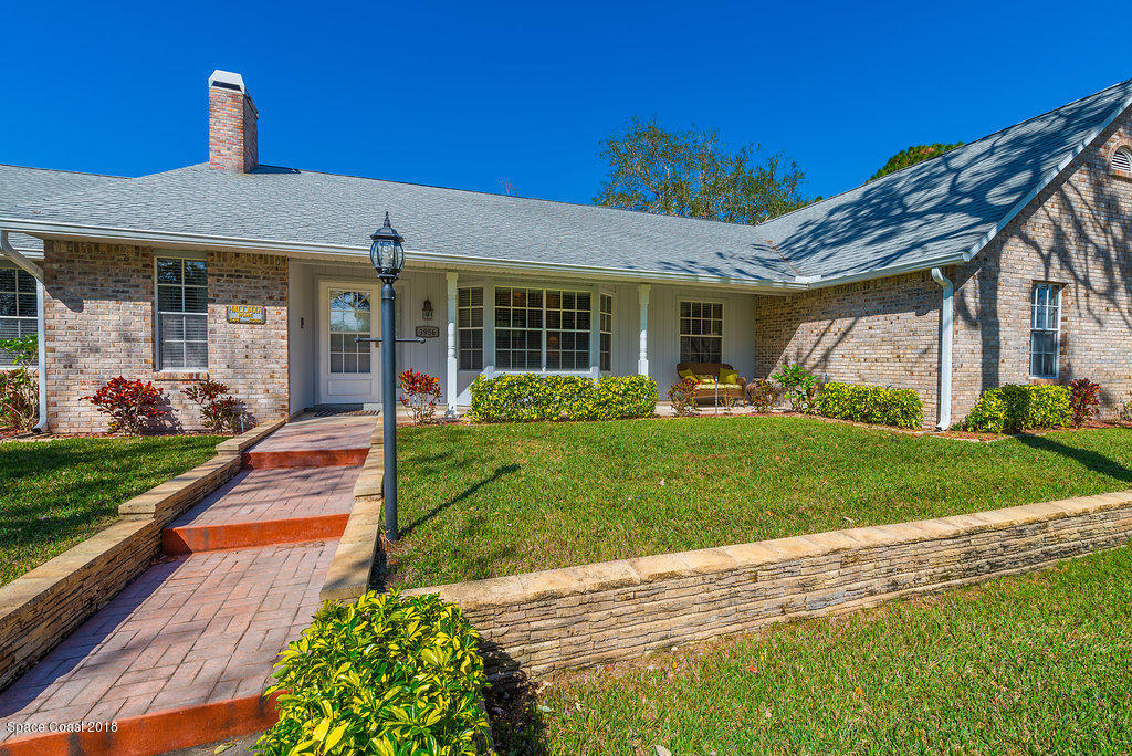 3956 Sparrow Hawk Road Melbourne, FL 32934 - Photo 2 of 34 a front view of a house with garden