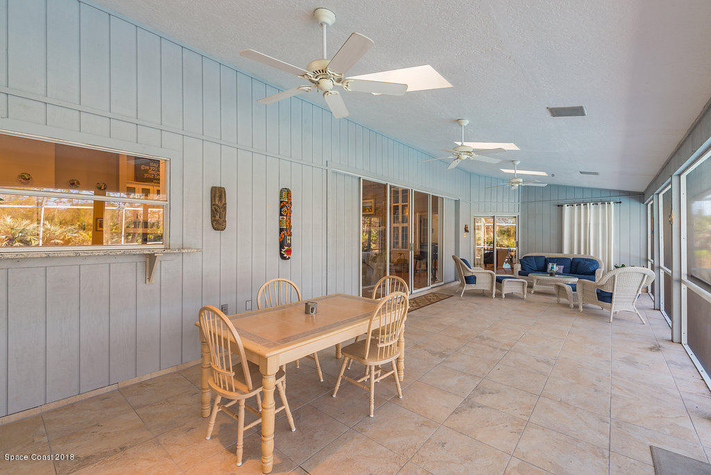 3956 Sparrow Hawk Road Melbourne, FL 32934 - Photo 28 of 34 a room with lots of chairs and a large window