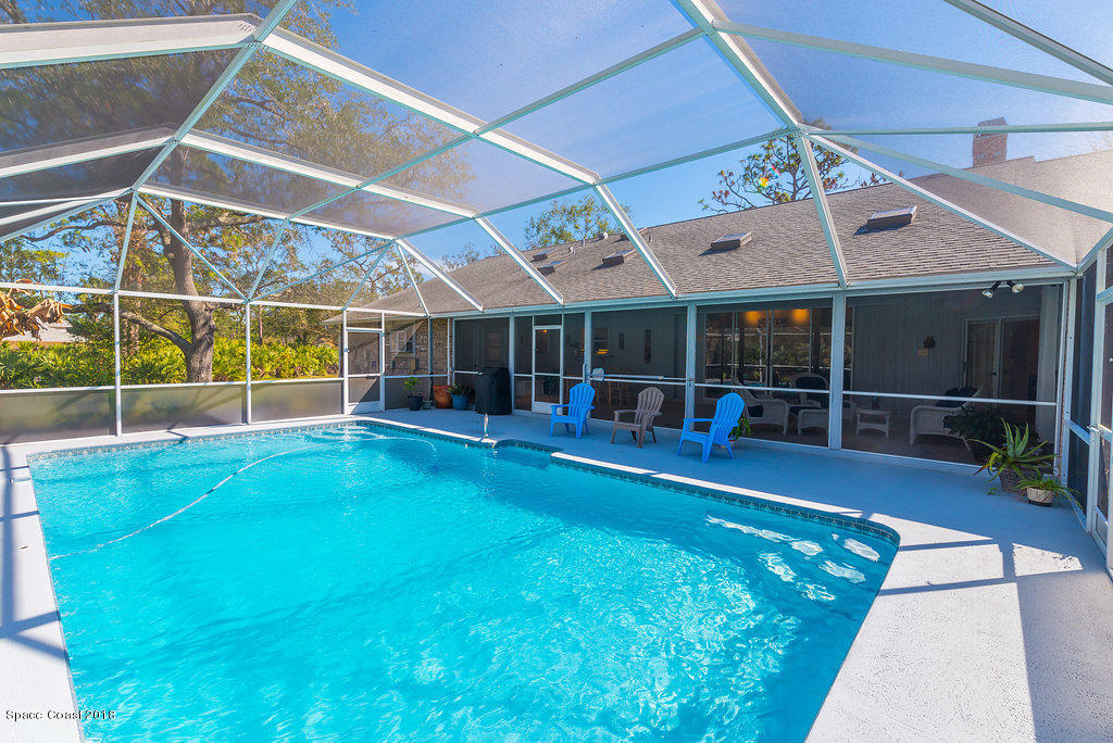 3956 Sparrow Hawk Road Melbourne, FL 32934 - Photo 29 of 34 a view of an chairs and tables in the patio