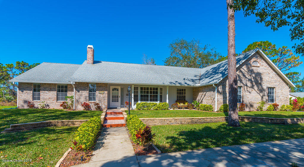 3956 Sparrow Hawk Road Melbourne, FL 32934 - Photo 32 of 34 a front view of a house with garden