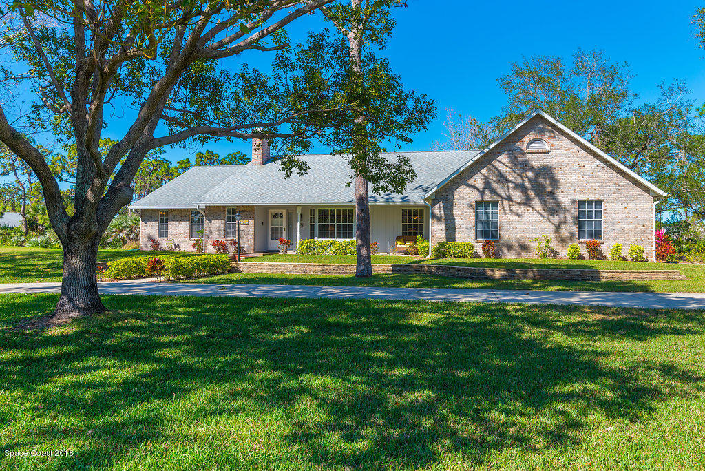 3956 Sparrow Hawk Road Melbourne, FL 32934 - Photo 34 of 34 a front view of a house with garden
