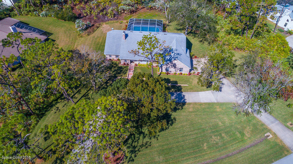 3956 Sparrow Hawk Road Melbourne, FL 32934 - Photo 5 of 34 an aerial view of a house