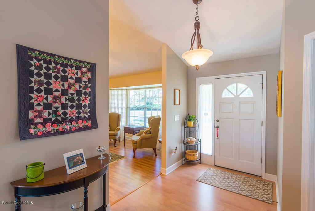 3956 Sparrow Hawk Road Melbourne, FL 32934 - Photo 6 of 34 a view of a livingroom with furniture and a window