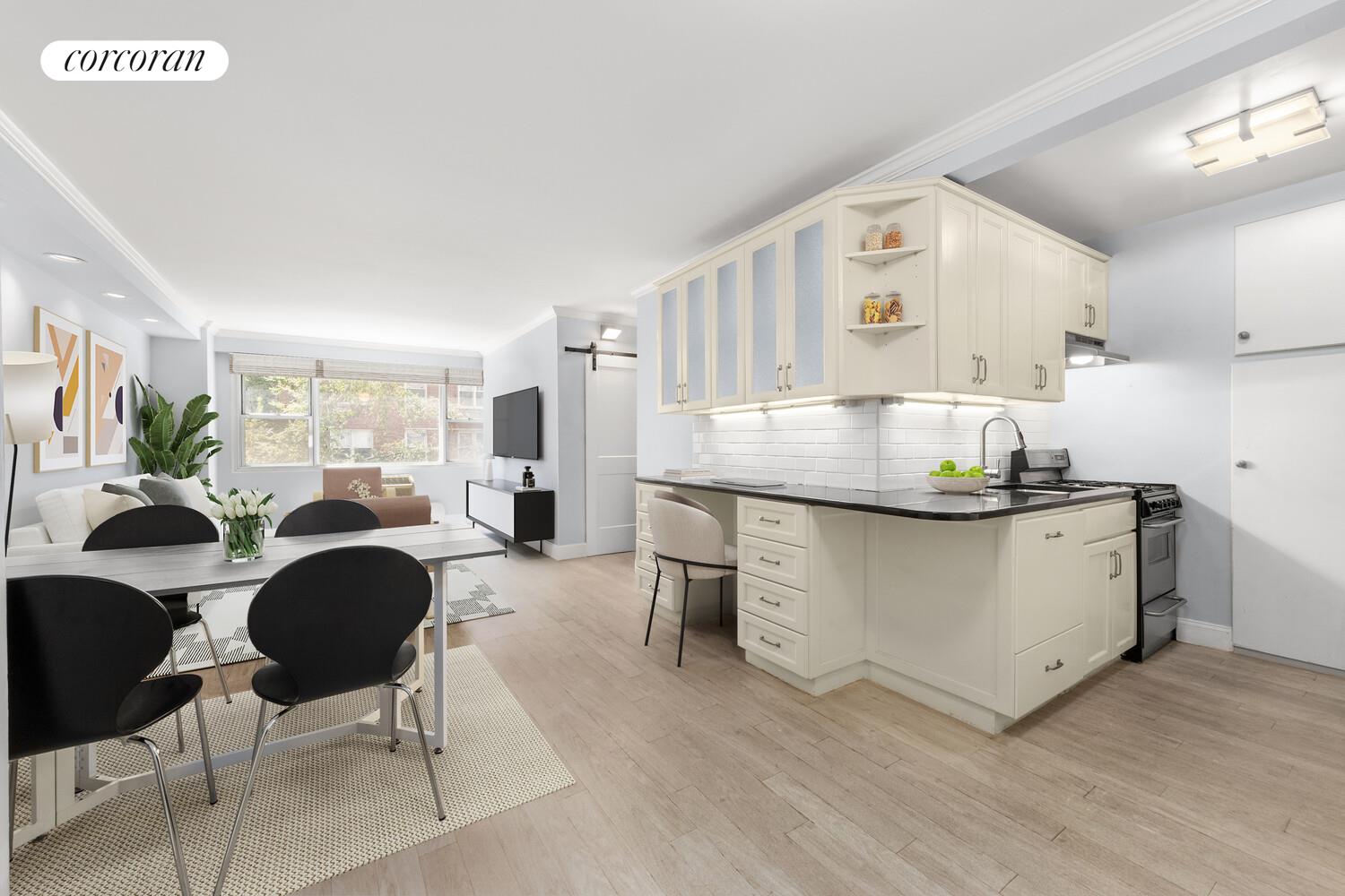 79 West 12th Street, Unit 3B Manhattan, NY 10011 - Photo 2 of 8 a living room with stainless steel appliances kitchen island granite countertop furniture a rug a kitchen view and a window