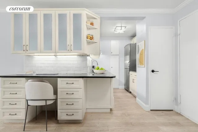 a living room with stainless steel appliances kitchen island granite countertop furniture a rug a kitchen view and a window