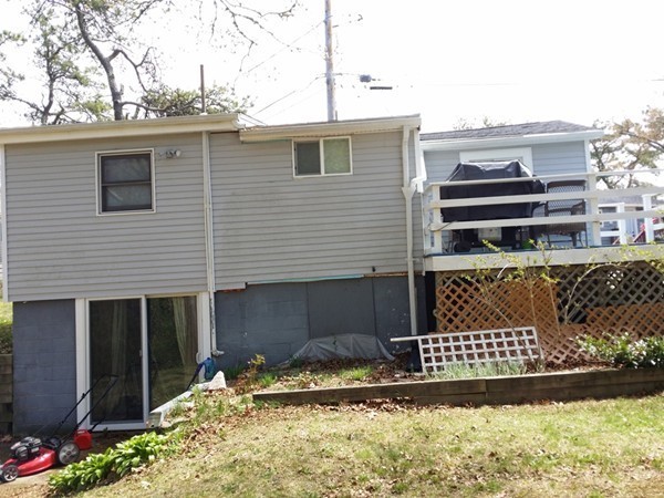 5 Thompson Road, Unit A Bourne, MA 02532 - Photo 12 of 13 a view of a house with a yard