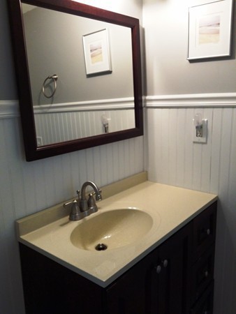 5 Thompson Road, Unit A Bourne, MA 02532 - Photo 6 of 13 a bathroom with a sink and a mirror