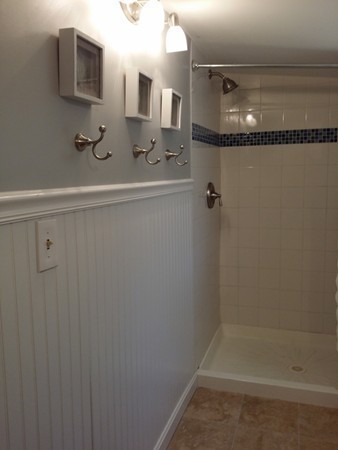 5 Thompson Road, Unit A Bourne, MA 02532 - Photo 7 of 13 a bathroom with a sink a toilet and shower
