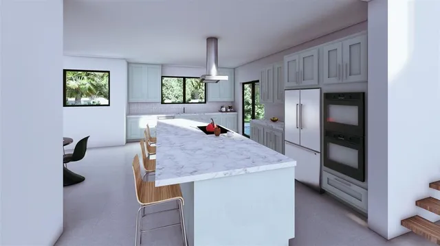 a dining hall with stainless steel appliances granite countertop a sink dishwasher and a refrigerator with wooden floor