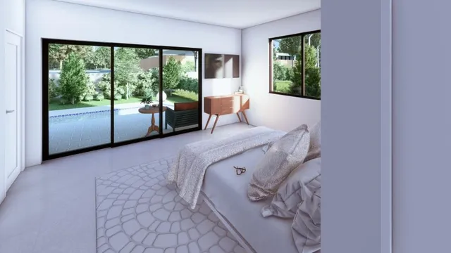 a bed sitting in a room next to a window