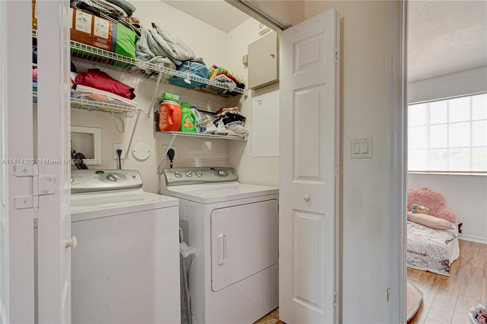 5894 Abbey Road Tamarac, FL 33321 - Photo 25 of 48 a utility room with dryer and washer