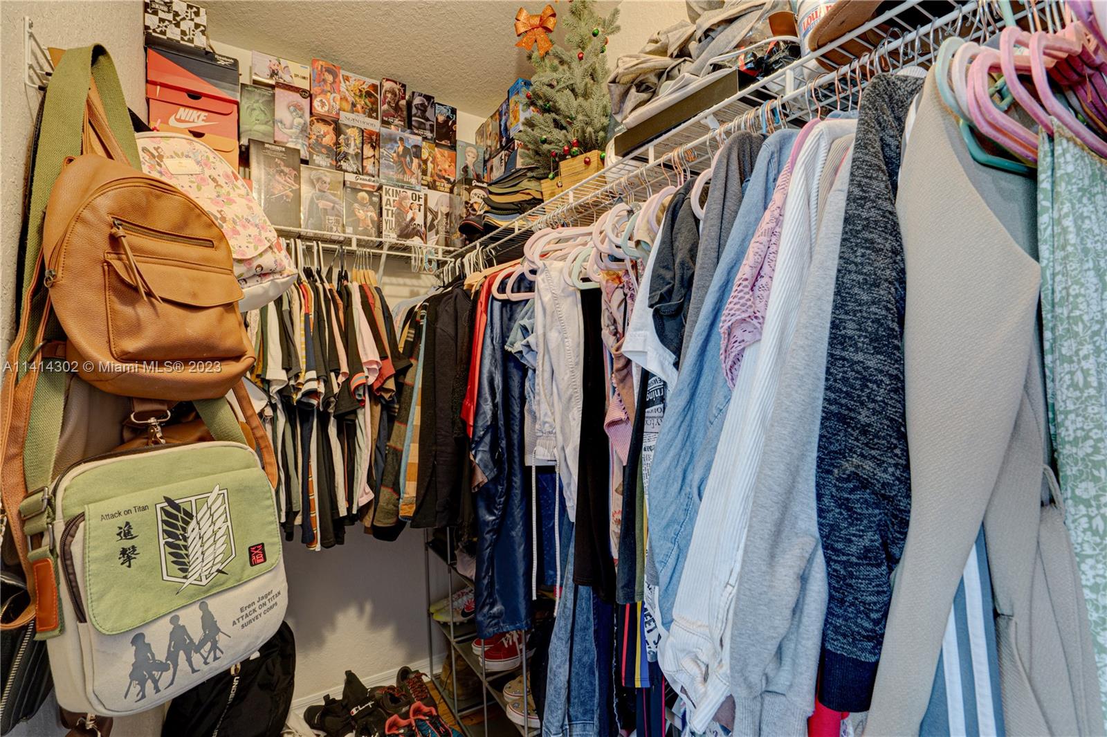 5894 Abbey Road Tamarac, FL 33321 - Photo 29 of 48 a view of walk in closet with clothes and shoes