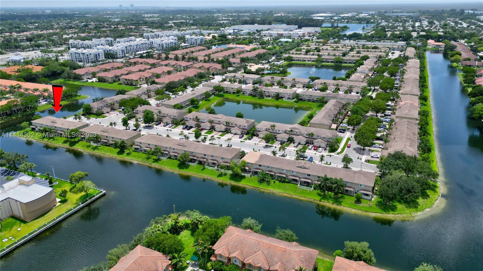 5894 Abbey Road Tamarac, FL 33321 - Photo 3 of 48 an aerial view of lake and residential houses with outdoor space