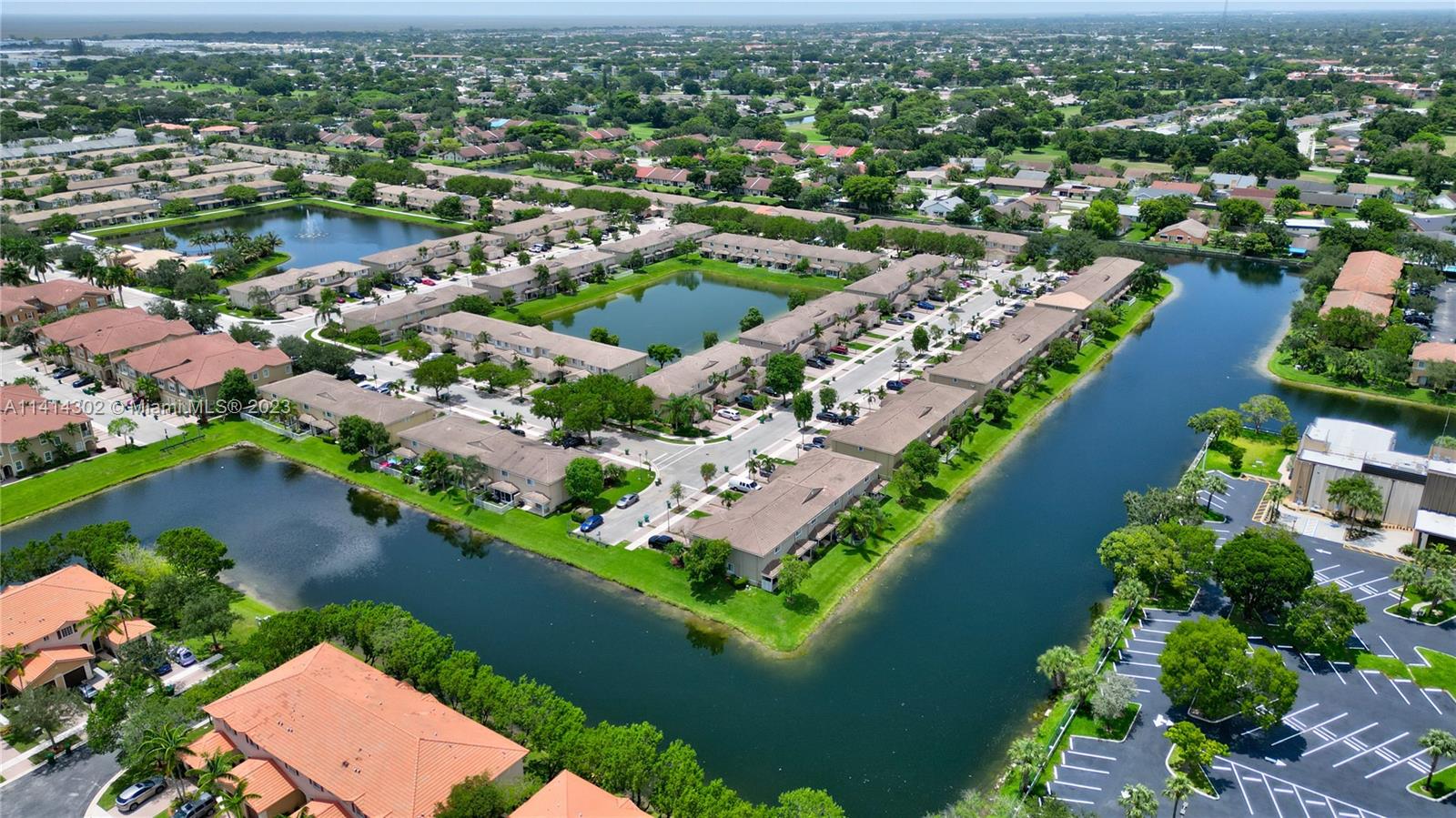 5894 Abbey Road Tamarac, FL 33321 - Photo 37 of 48 an aerial view of a city with lots of residential buildings lake and ocean view