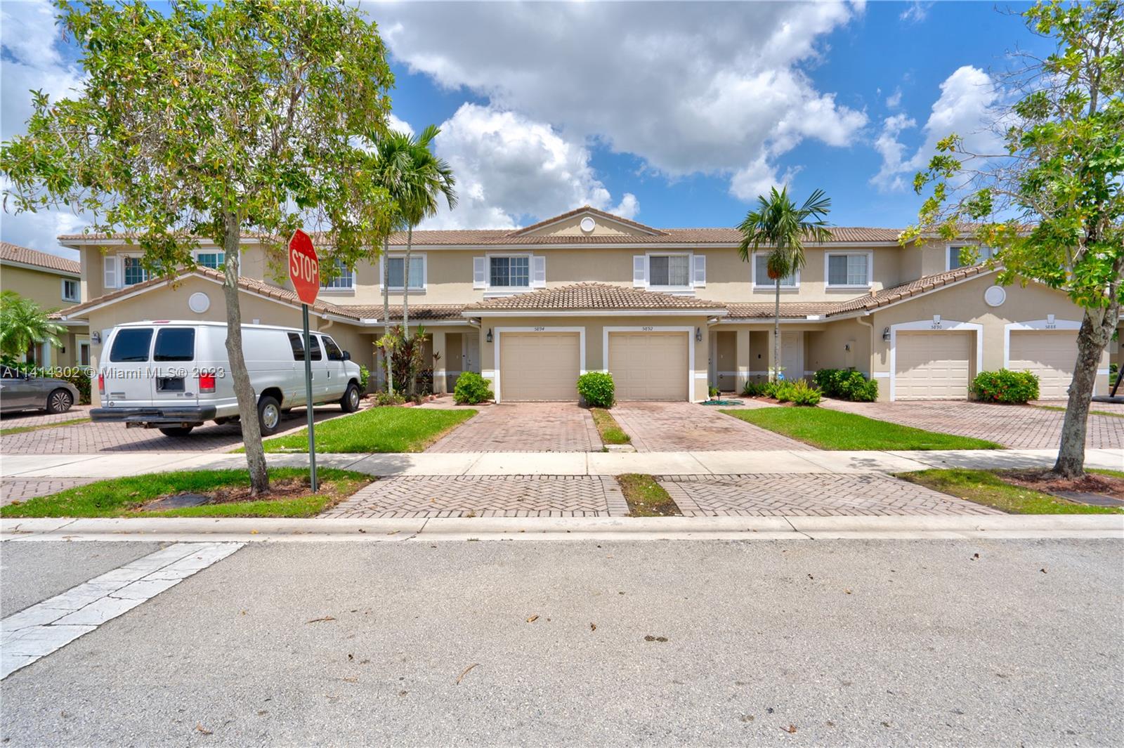5894 Abbey Road Tamarac, FL 33321 - Photo 4 of 48 a front view of house with yard and green space