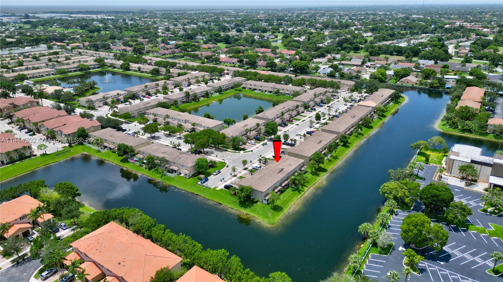 5894 Abbey Road Tamarac, FL 33321 - Photo 42 of 48 an aerial view of a city with lots of residential buildings lake and ocean view