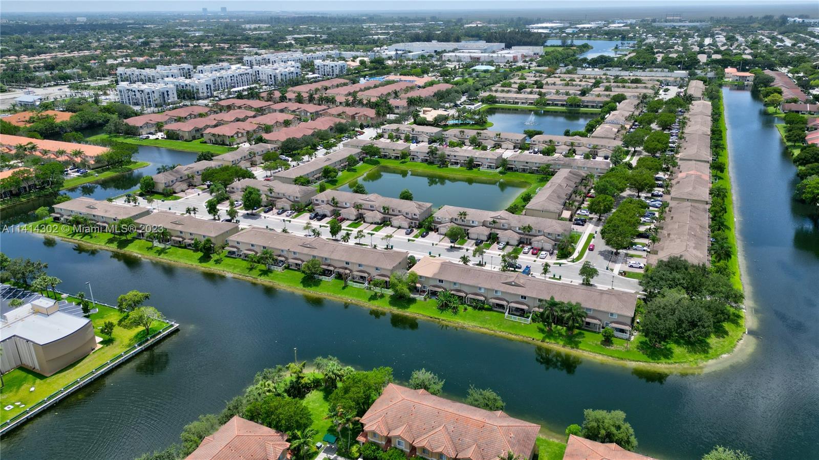 5894 Abbey Road Tamarac, FL 33321 - Photo 44 of 48 an aerial view of a city with lake view