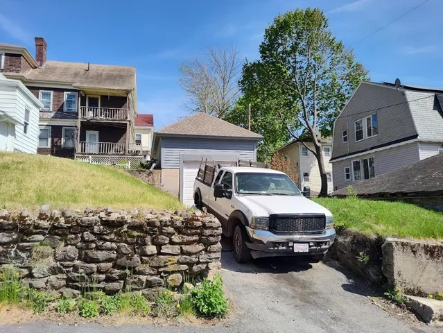 a car parked in front of a house