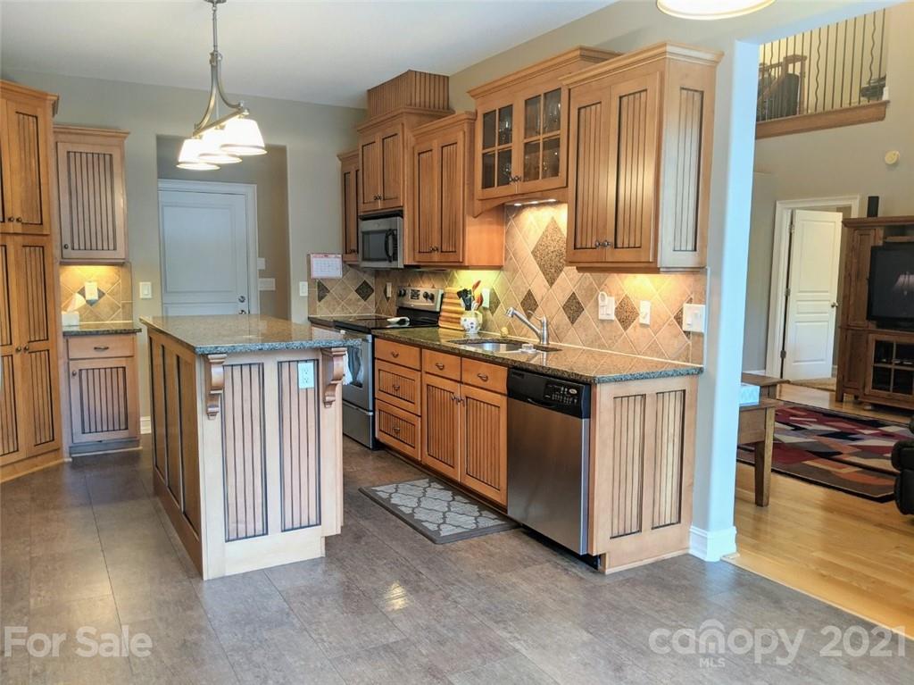 259 Beechtree Circle Rutherfordton, NC 28139 - Photo 2 of 48 a kitchen with stainless steel appliances granite countertop a stove a sink dishwasher and a refrigerator