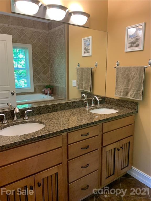 259 Beechtree Circle Rutherfordton, NC 28139 - Photo 15 of 48 a bathroom with a granite countertop sink and a mirror