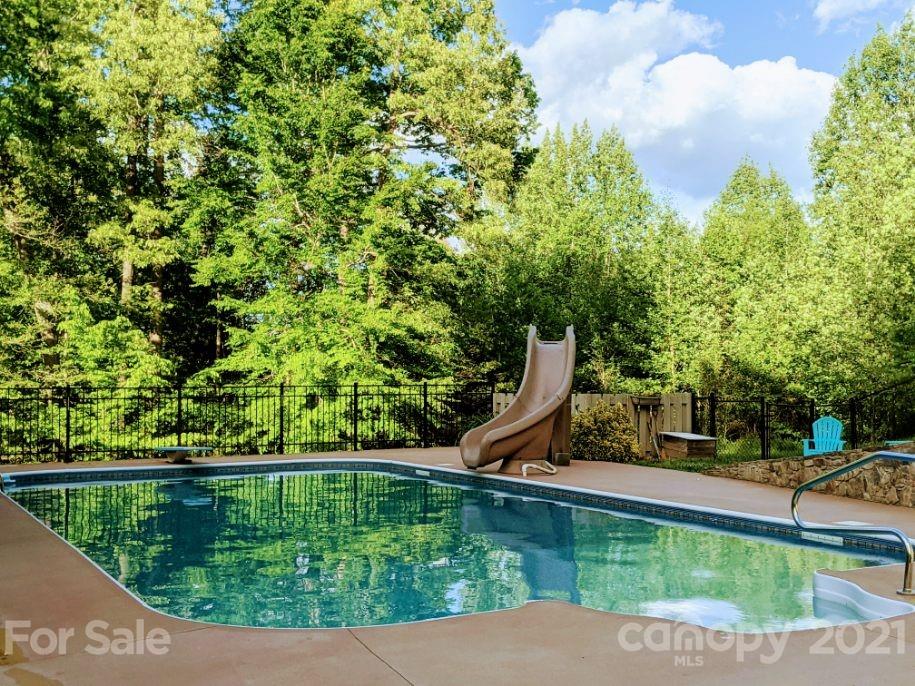 259 Beechtree Circle Rutherfordton, NC 28139 - Photo 43 of 48 a view of a garden with a bench and trees around