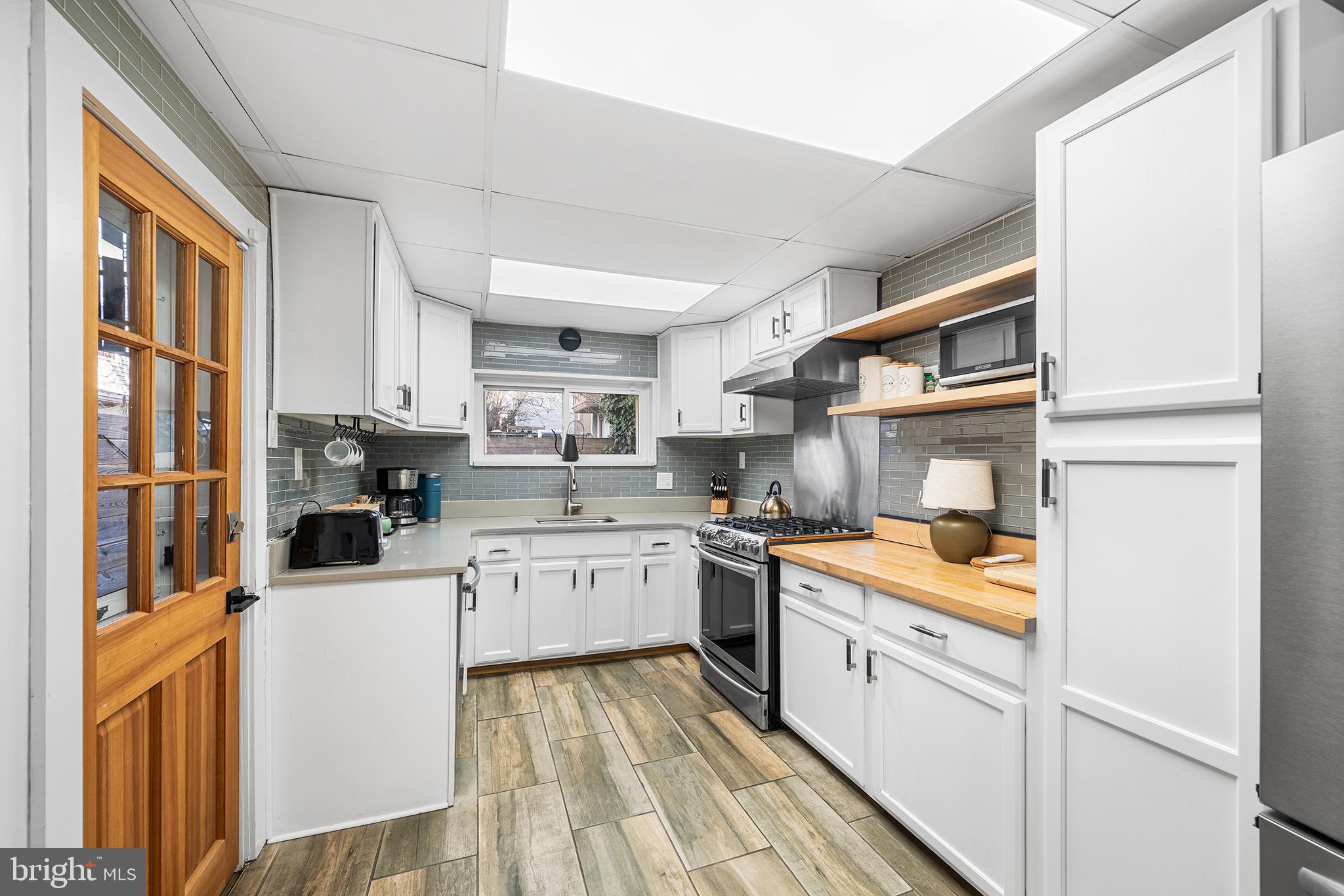 2425 Sepviva Street Philadelphia, PA 19125 - Photo 11 of 34 a kitchen with a sink stove and refrigerator
