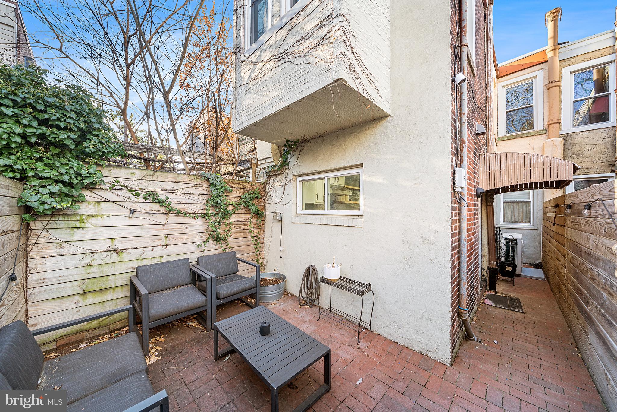 2425 Sepviva Street Philadelphia, PA 19125 - Photo 15 of 34 a view of a patio with a table and chairs