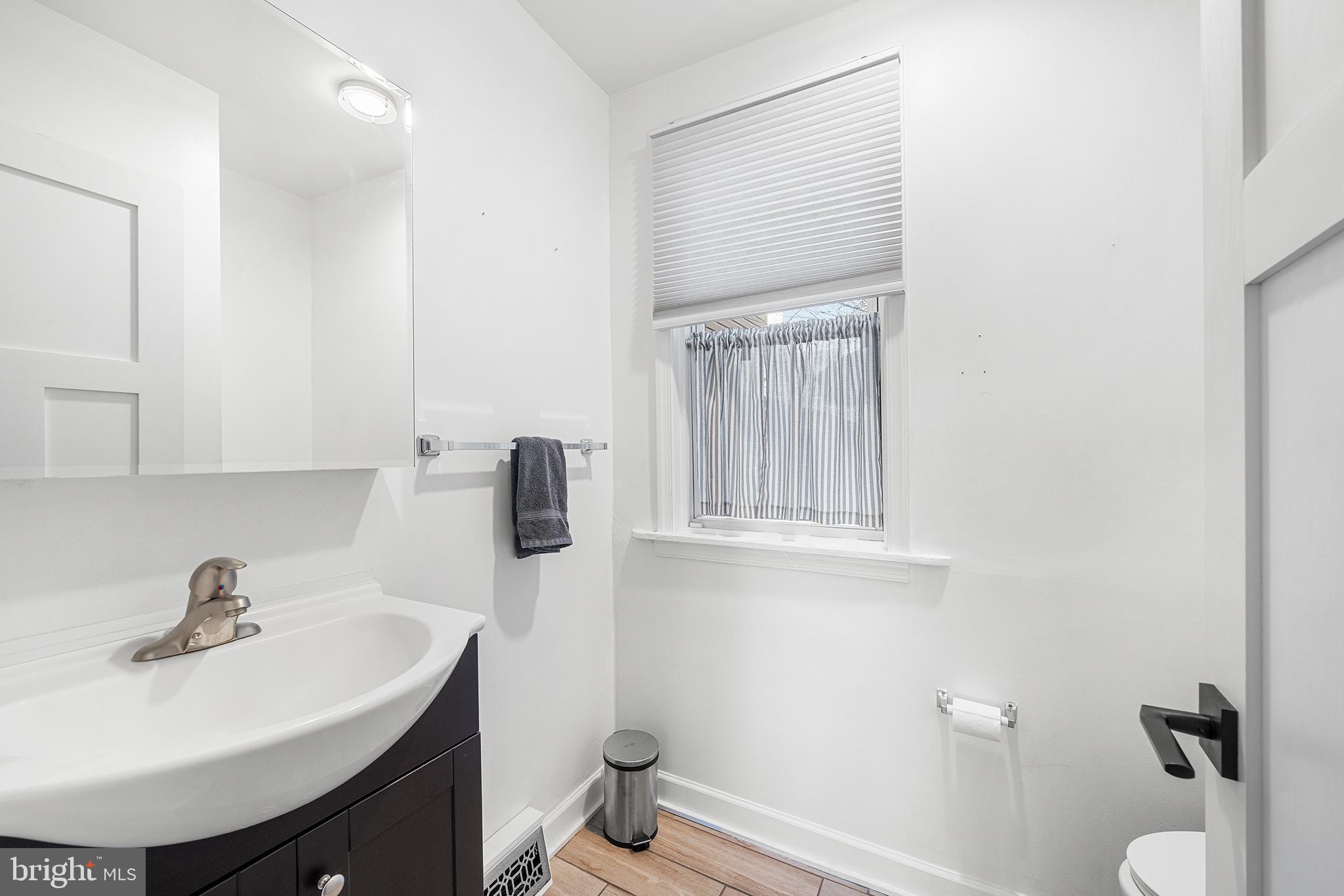 2425 Sepviva Street Philadelphia, PA 19125 - Photo 16 of 34 a bathroom with a sink toilet and mirror