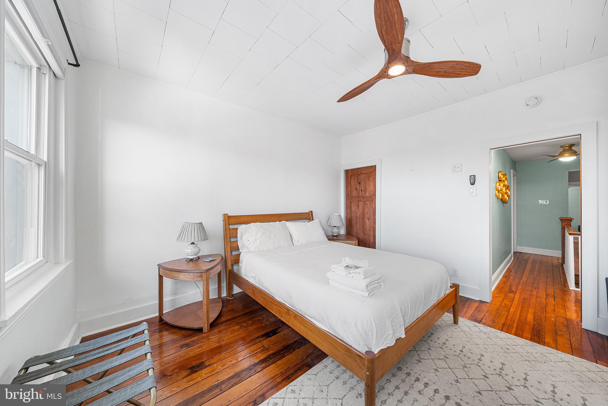 2425 Sepviva Street Philadelphia, PA 19125 - Photo 20 of 34 a bedroom with a bed and a table in it