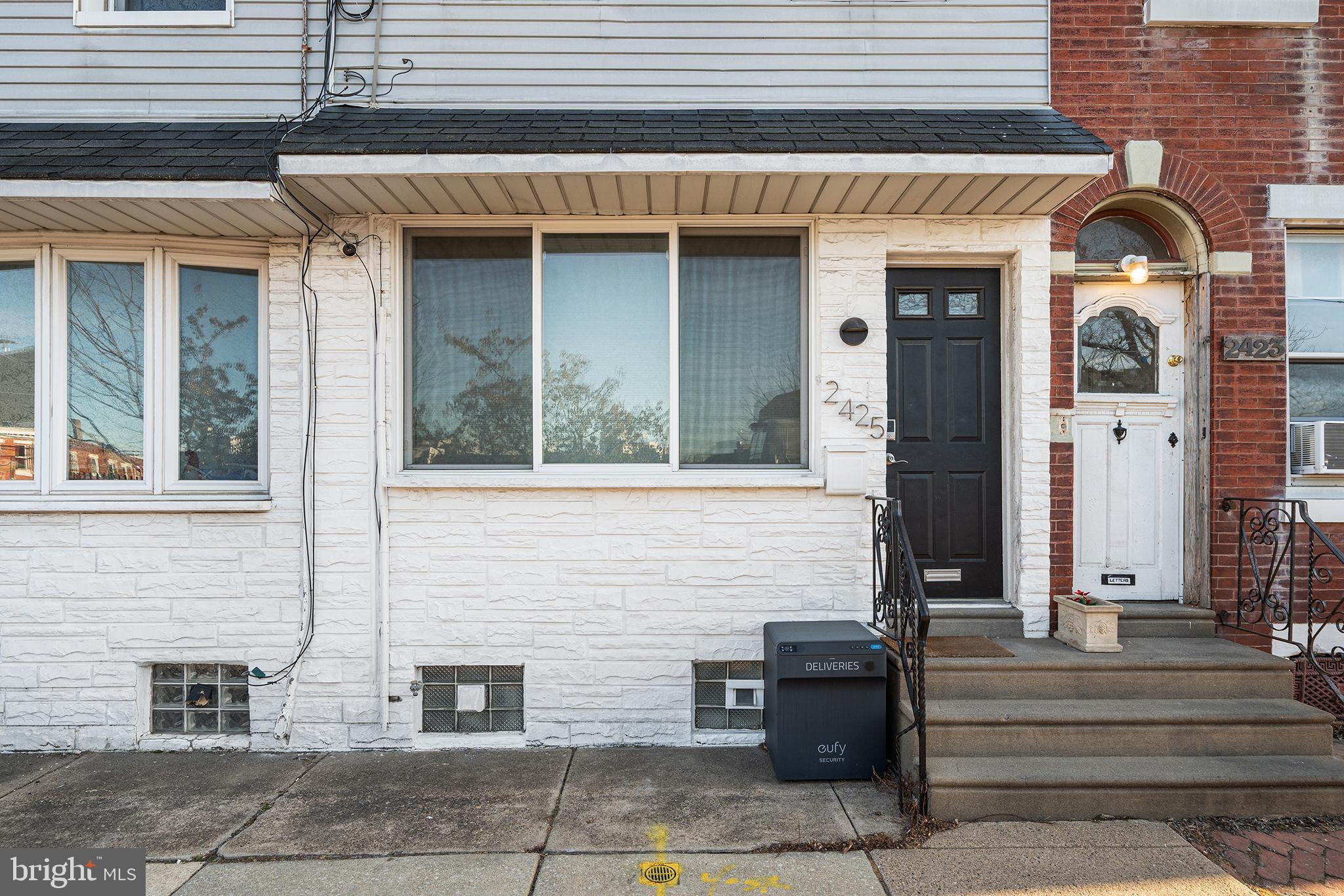 2425 Sepviva Street Philadelphia, PA 19125 - Photo 2 of 34 a front view of a house with stairs