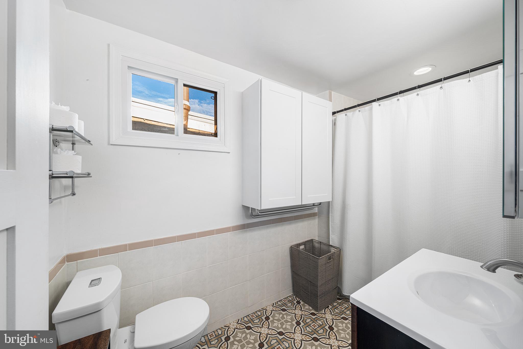 2425 Sepviva Street Philadelphia, PA 19125 - Photo 21 of 34 a bathroom with a sink toilet and mirror