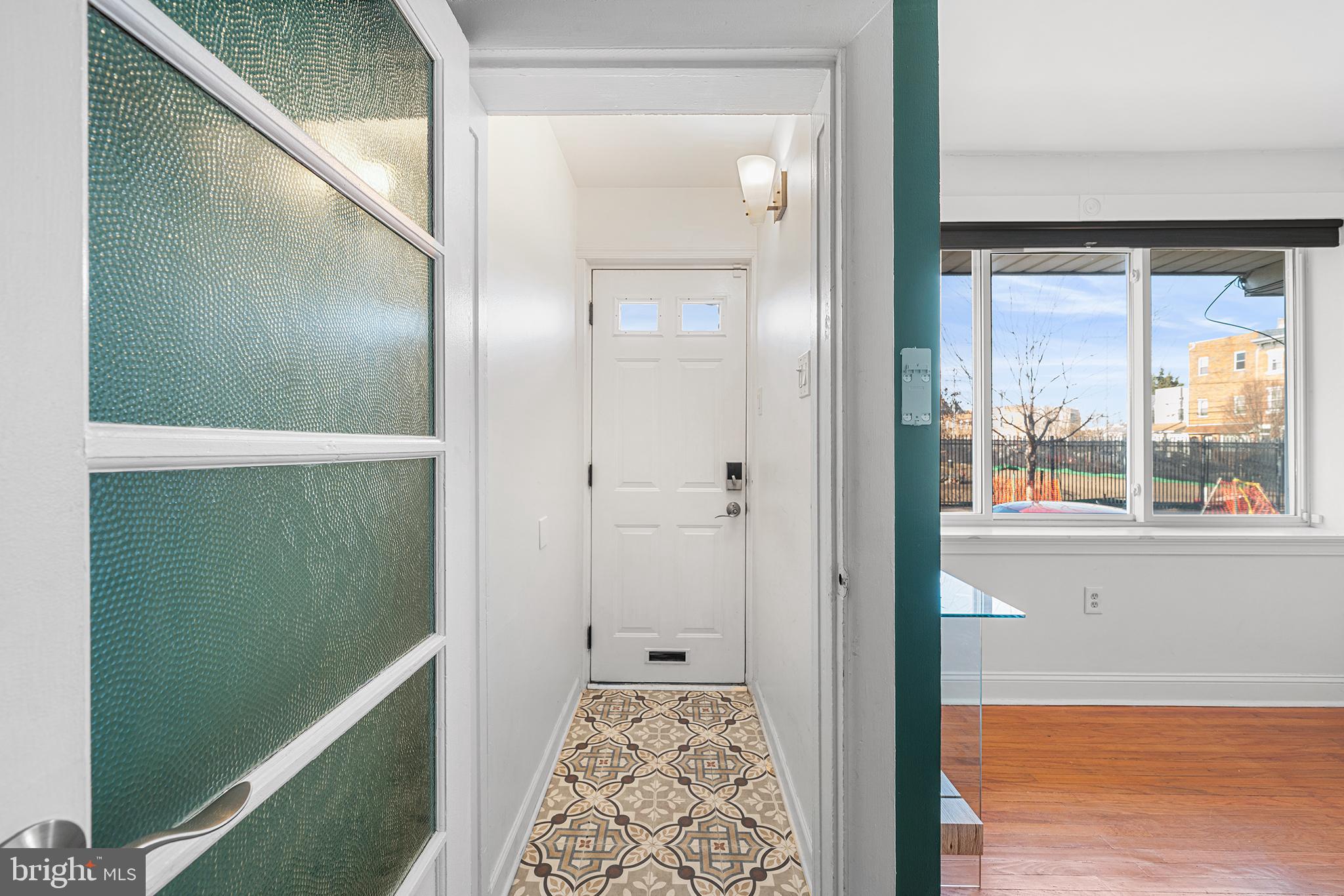 2425 Sepviva Street Philadelphia, PA 19125 - Photo 3 of 34 a view of hallway with a large window and wooden floor