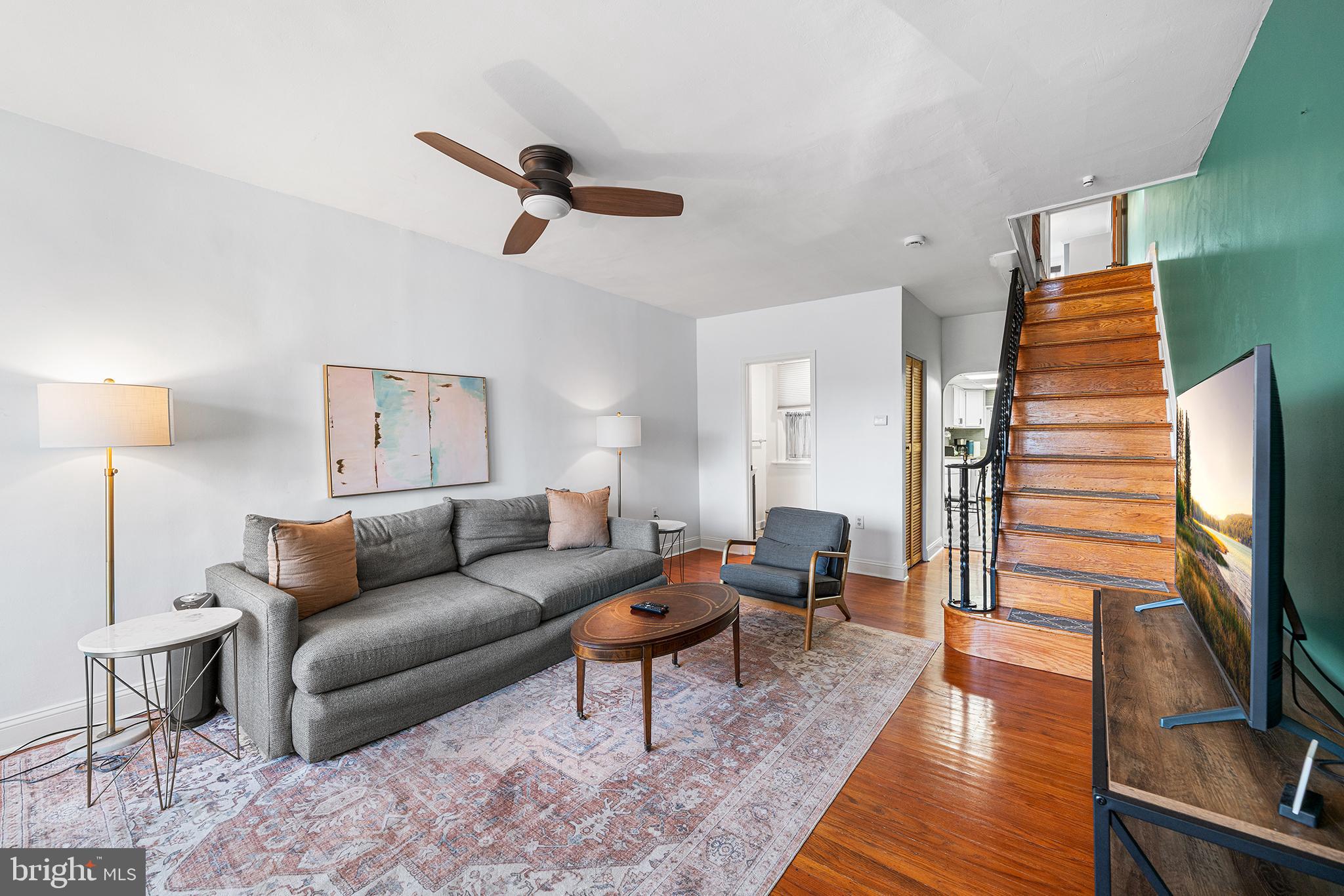 2425 Sepviva Street Philadelphia, PA 19125 - Photo 6 of 34 a living room with furniture wooden floor and a flat screen tv