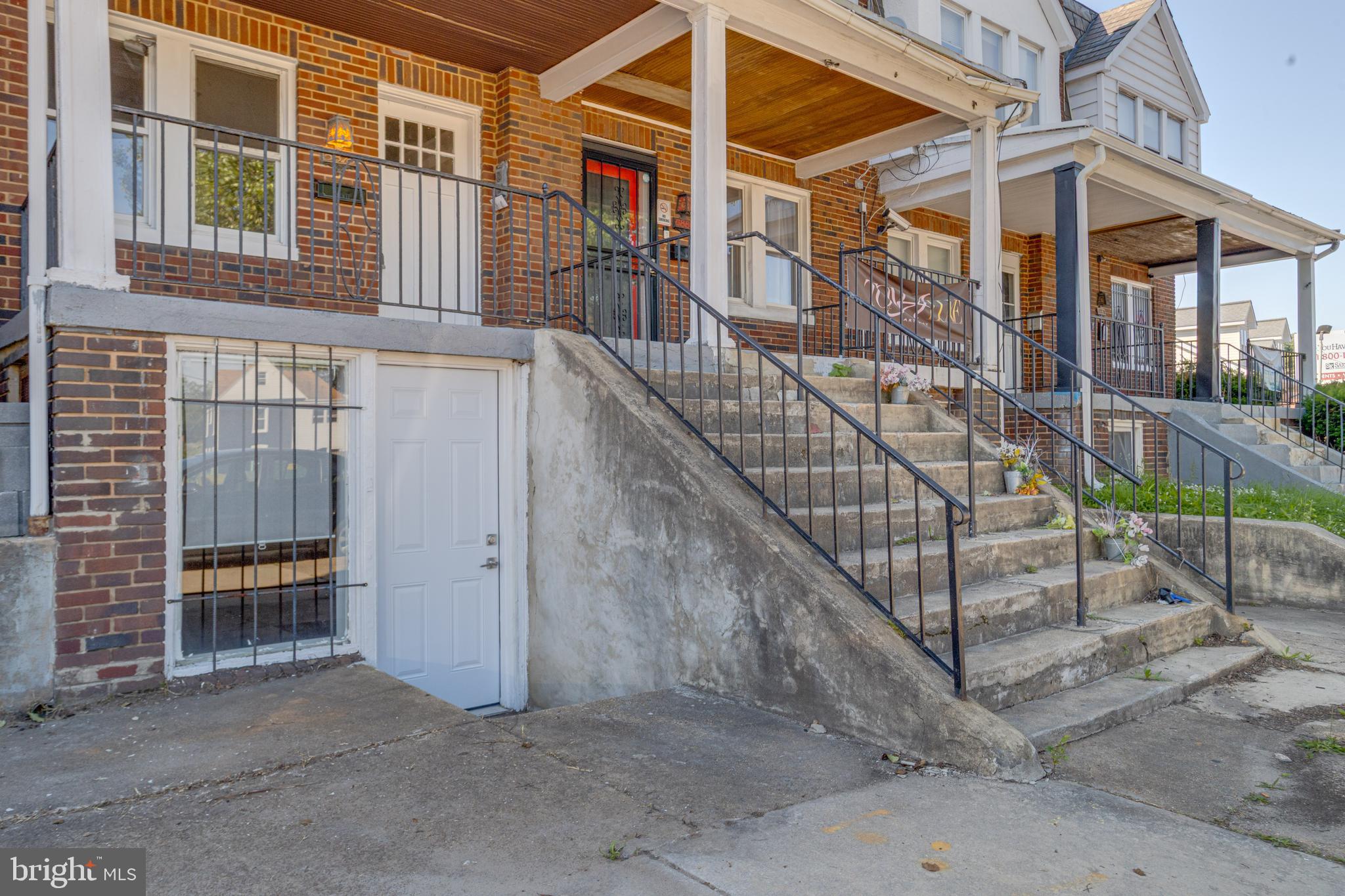 5878 Belair Road Baltimore, MD 21206 - Photo 2 of 41 front view of a house with a small yard