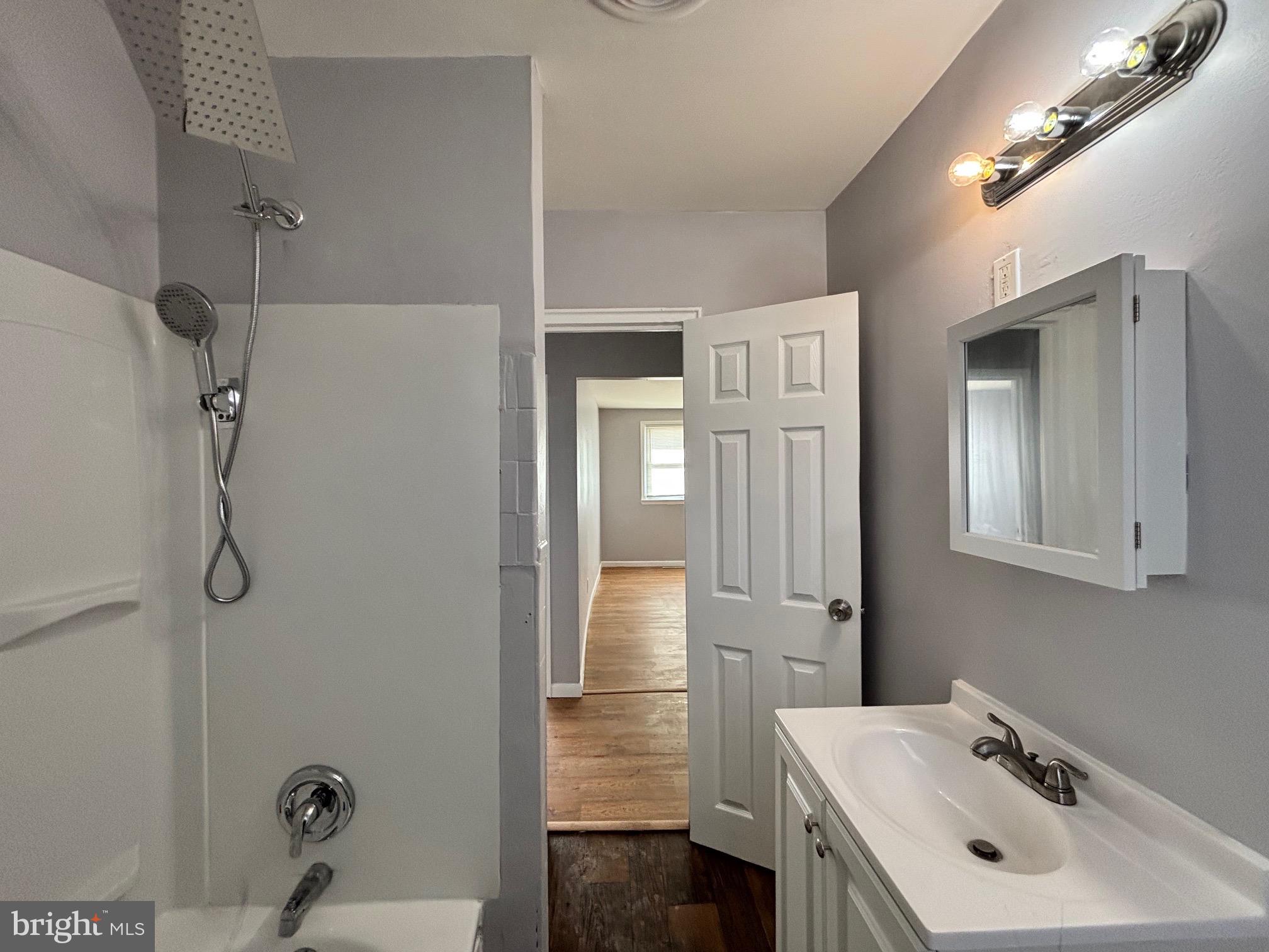 164 Kinsley Road Pemberton, NJ 08068 - Photo 12 of 15 a bathroom with a sink a shower and a mirror