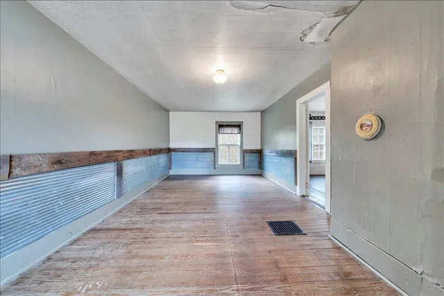 a kids room with toys and wooden floor
