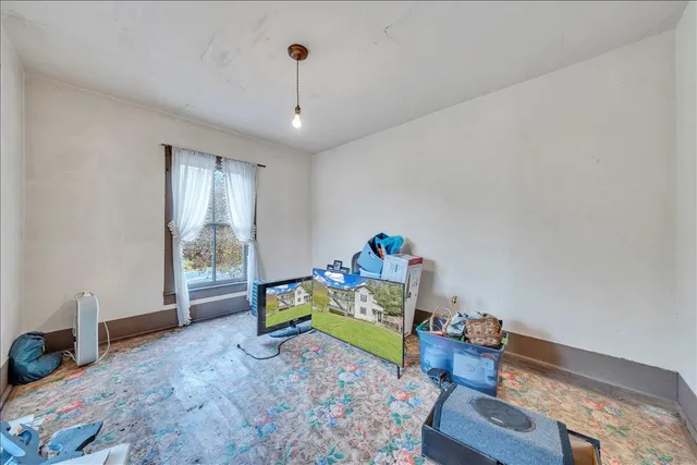 a bed room with furniture and a window