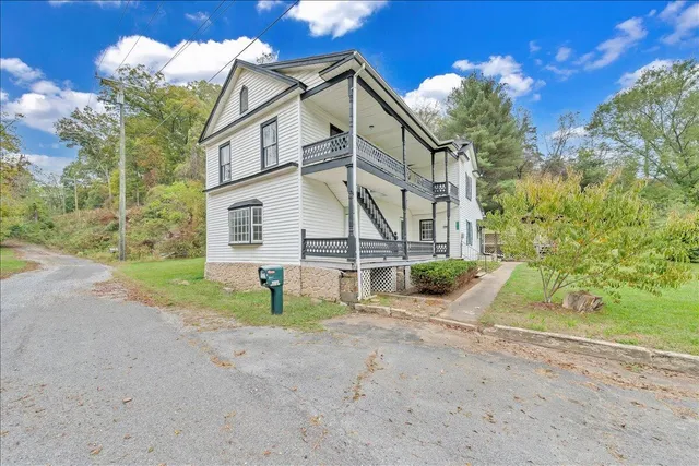 a view of a house with a street