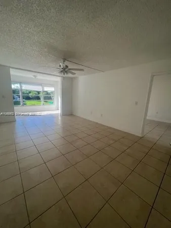 an empty room with a empty space and a window